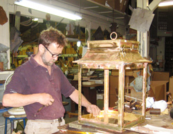 Photo of the making of lamps for the Boston Museum
