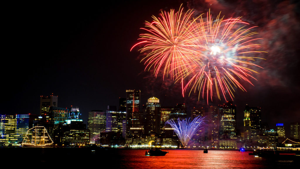 nighttime picture of winter in Boston with First Night Boston Celebration fireworks going off